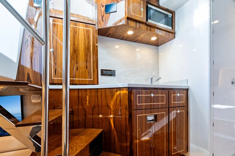 Slide: The Image of Luxurious interior of 2025 HCB 56 Suenos GIX yacht with elegant wood cabinetry. - 46