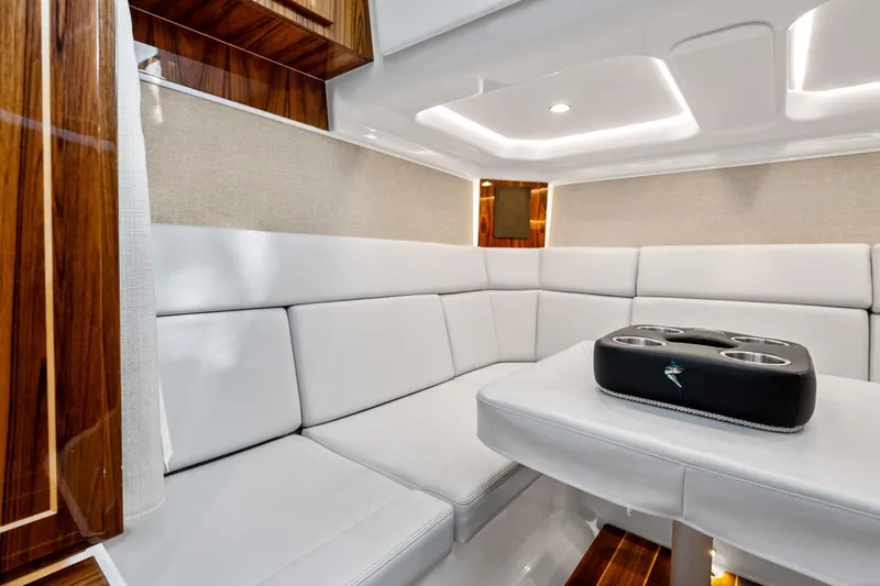 Slide: The Image of Luxurious interior of 2025 HCB 56 Suenos GIX yacht with white seating and wood accents. - 55