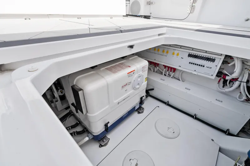 Slide: The Image of Engine compartment of 2025 HCB 56 Suenos GIX, featuring battery distribution and wiring. - 57