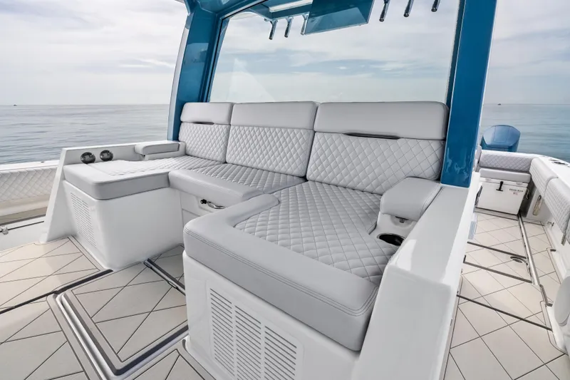 Slide: The Image of Luxurious seating on the 2025 HCB 56 Suenos GIX boat, featuring quilted upholstery. - 6