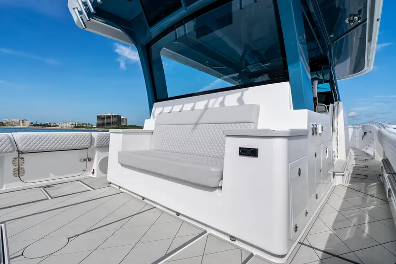 Slide: The Image of 2025 HCB 56 Suenos GIX luxury yacht deck with seating, ocean view. - 62