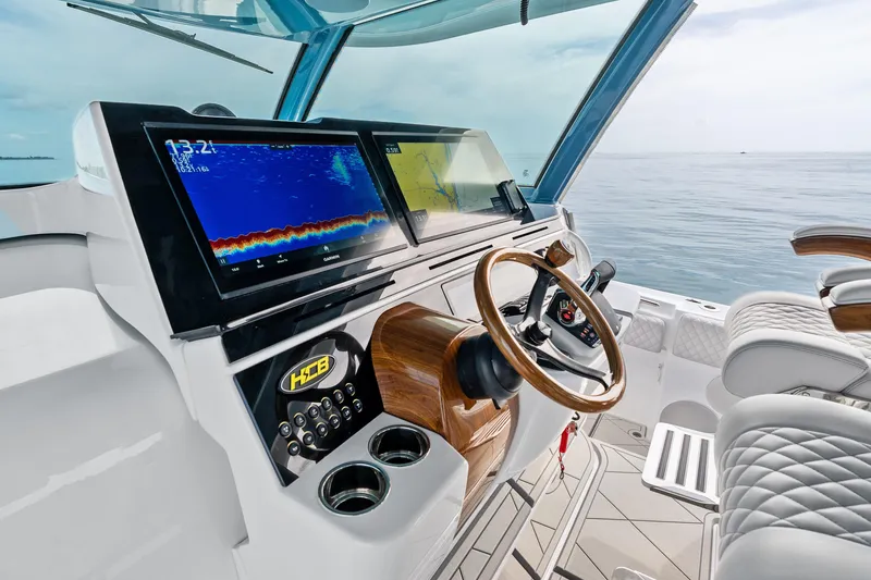 Slide: The Image of Luxurious helm of 2025 HCB 56 Suenos GIX with advanced navigation displays. - 64