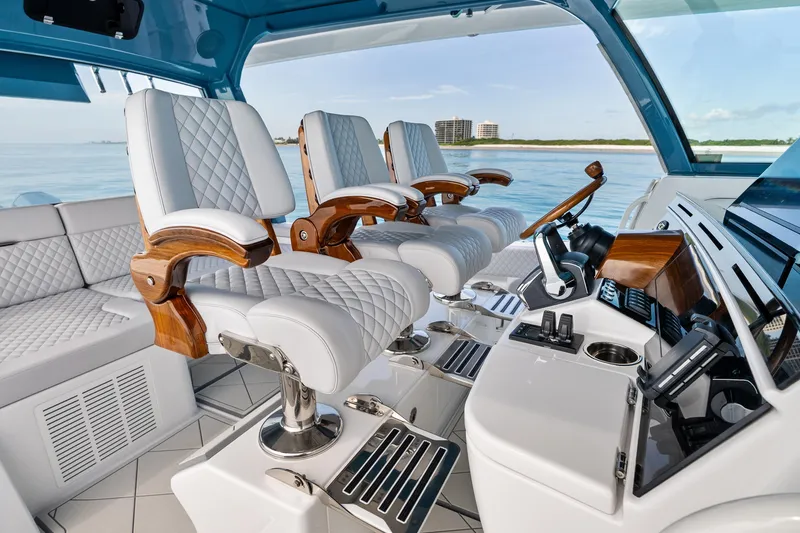 Slide: The Image of Luxurious interior of 2025 HCB 56 Suenos GIX yacht with plush seating and modern controls. - 9