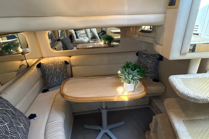 Slide: The Image of Luxurious interior of 1999 Sea Ray 380 Sundancer with cozy seating and elegant decor. - 19