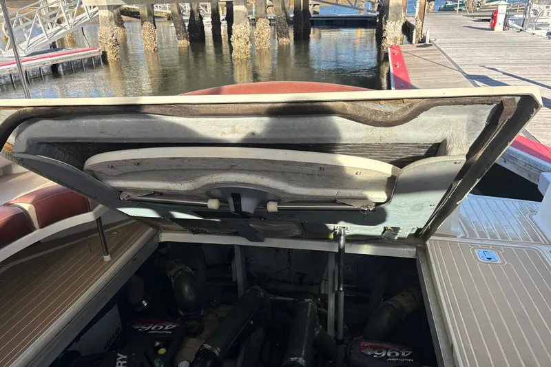 Slide: The Image of Open engine compartment of 1999 Sea Ray 380 Sundancer at dockside. - 23