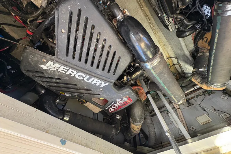 Slide: The Image of Engine compartment of a 1999 Sea Ray 380 Sundancer with Mercury components. - 25