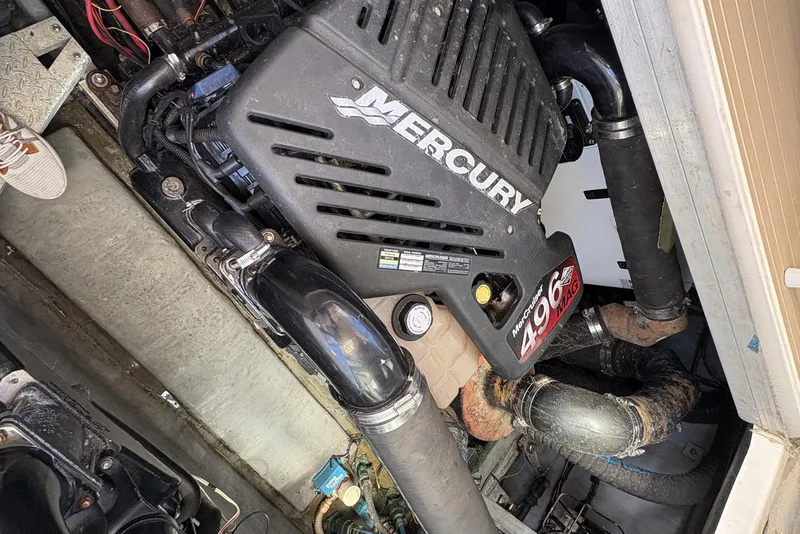 Slide: The Image of Engine compartment of a 1999 Sea Ray 380 Sundancer with Mercury 496 Mag engine. - 26