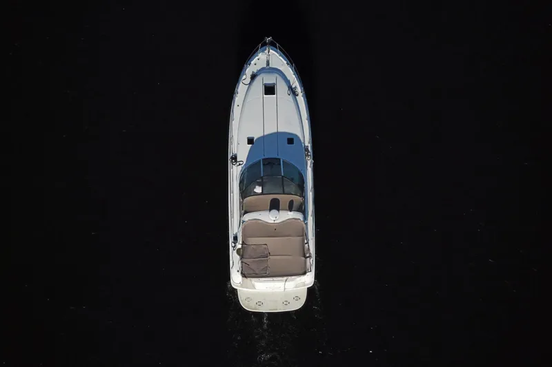 Slide: The Image of Overhead view of 1999 Sea Ray 380 Sundancer boat on dark water. - 30