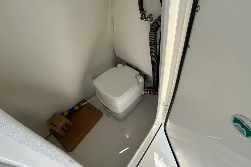Slide: The Image of Compact marine toilet in 2026 World Cat 235 TE boat cabin. - 15
