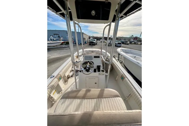 Slide: The Image of 2017 Carolina Skiff 21 Ultra Elite boat interior with steering console and seating. - 2