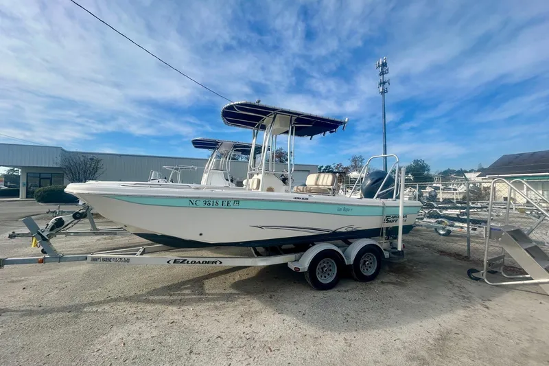 Slide: The Image of 2017 Carolina Skiff 21 Ultra Elite boat on trailer under blue sky. - 5