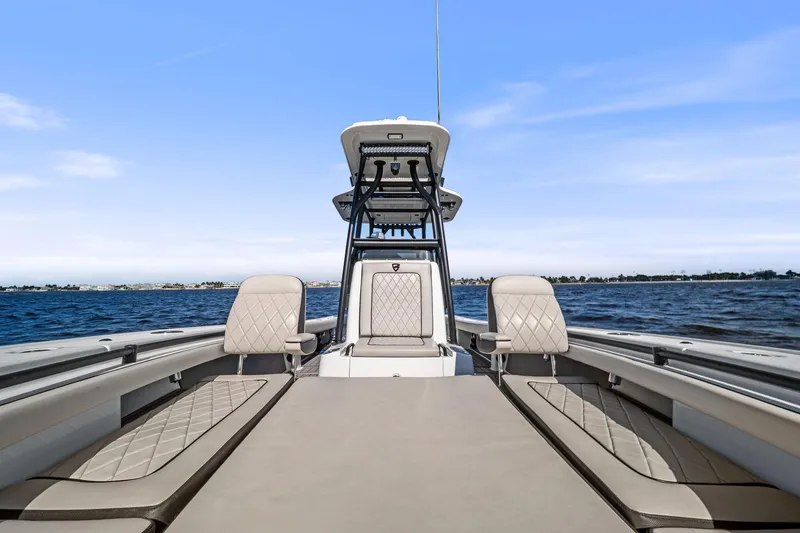 Slide: The Image of 2021 Barker Boatworks 26 Open on water, showcasing spacious seating and sleek design. - 23
