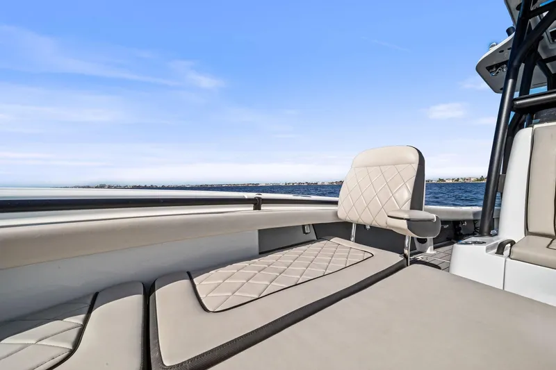 Slide: The Image of 2021 Barker Boatworks 26 Open, luxurious seating, ocean view, clear blue sky. - 25