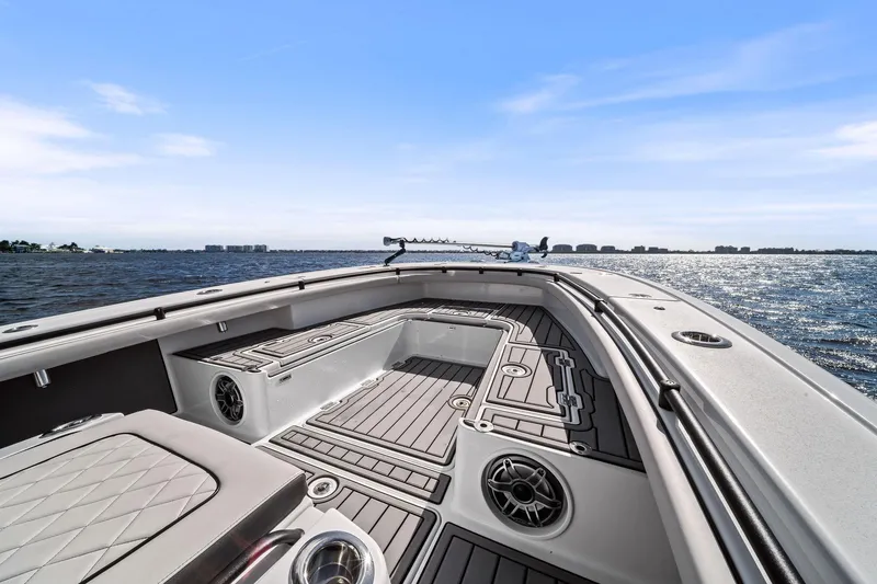 Slide: The Image of 2021 Barker Boatworks 26 Open on water, showcasing deck and seating. - 28