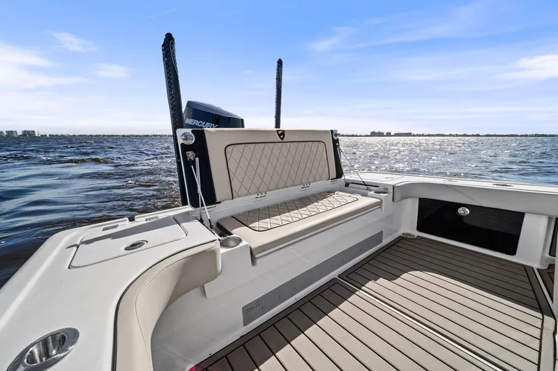 Slide: The Image of 2021 Barker Boatworks 26 Open, spacious deck with seating, on calm waters. - 36