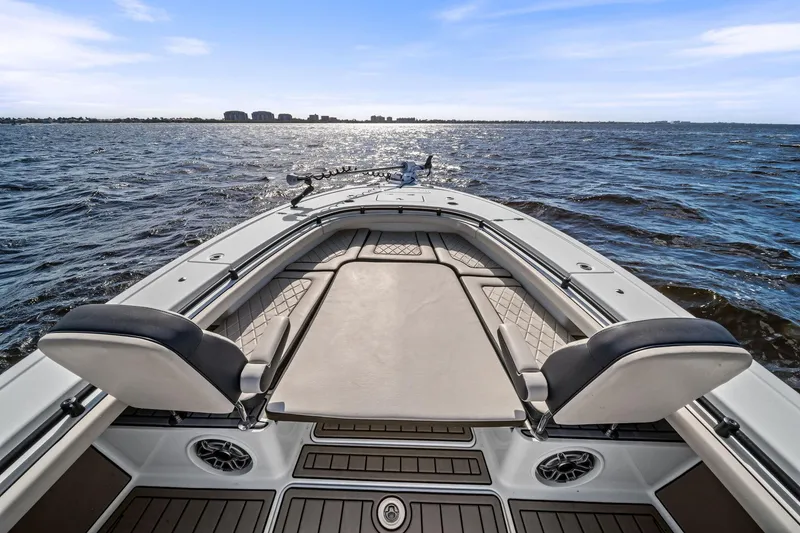 Slide: The Image of 2021 Barker Boatworks 26 Open on water, showcasing spacious deck and seating. - 21
