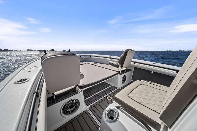 Slide: The Image of 2021 Barker Boatworks 26 Open on water, featuring comfortable seating and sleek design. - 22