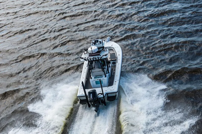 Slide: The Image of 2021 Barker Boatworks 26 Open cruising on choppy waters, rear view. - 39