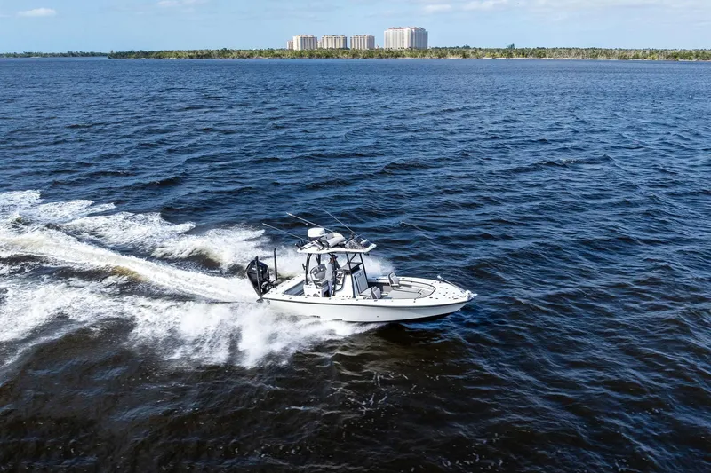 Slide: The Image of 2021 Barker Boatworks 26 Open cruising on open water, distant shoreline visible. - 40