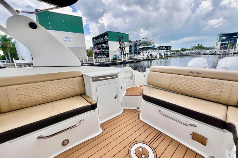 Slide: The Image of 2019 Sea Ray SDX 290 Outboard boat interior with luxurious seating and sleek design. - 6