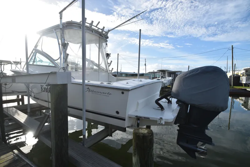 Slide: The Image of 2017 Albemarle 25 Express boat docked at marina during sunset. - 1