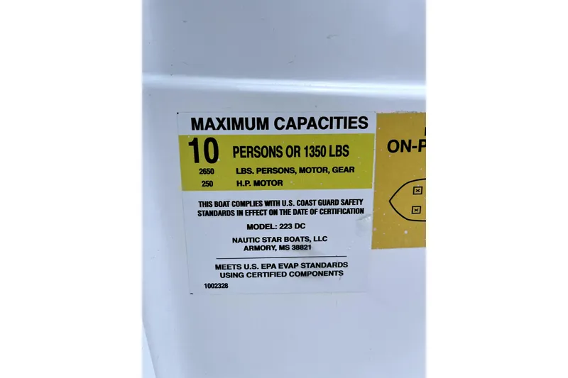 Slide: The Image of 2025 NauticStar 223 DC capacity label: 10 persons or 1350 lbs, 250 HP motor. - 8