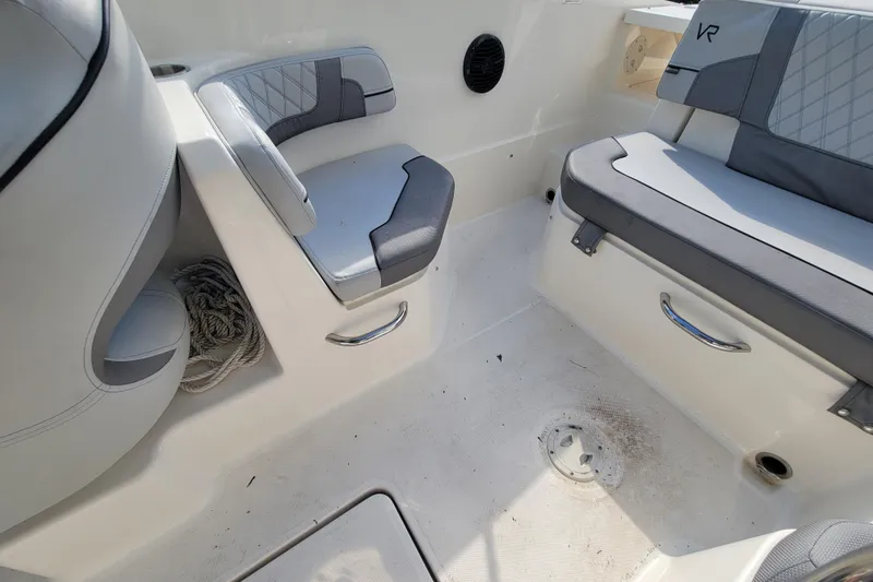 Slide: The Image of 2023 Bayliner VR6 Bowrider OB interior seating with storage and rope. - 23