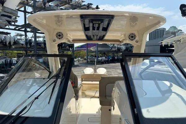 Slide: The Image of 2022 Scout 277 Dorado boat interior with open cockpit and seating area. - 5