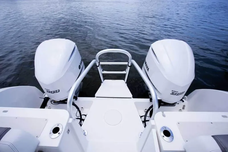 Slide: The Image of Manufacturer Provided Image: 2026 World Cat 295 CC boat with twin Yamaha outboard engines on calm water. - 10