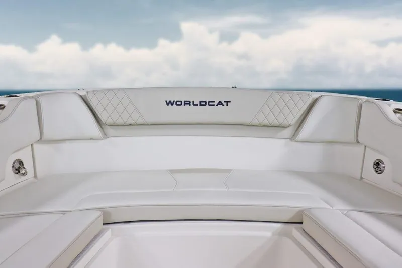 Slide: The Image of Manufacturer Provided Image: 2026 World Cat 295 CC boat interior with white seating and ocean backdrop. - 5