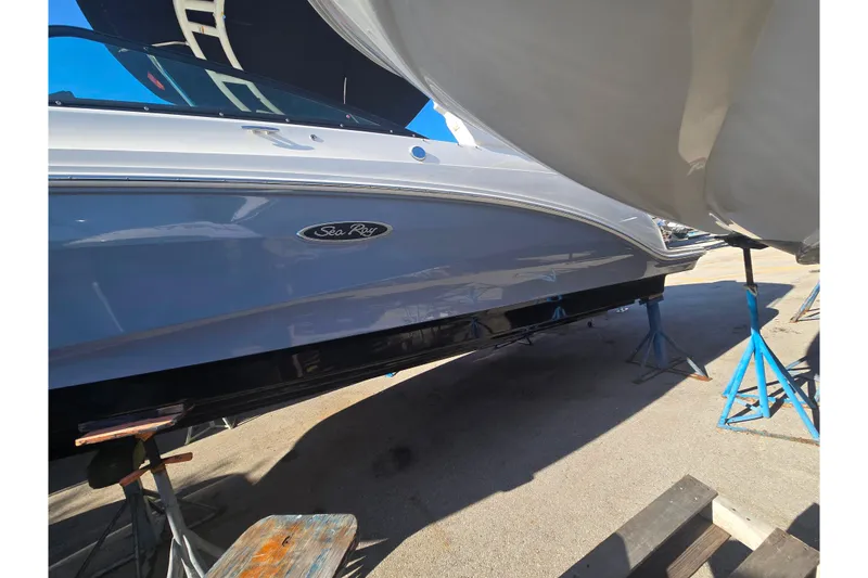 Slide: The Image of 2024 Sea Ray SDX 250 Outboard boat on stands, side view. - 15