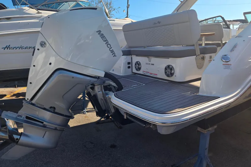 Slide: The Image of 2024 Sea Ray SDX 250 Outboard boat with Mercury engine, rear view. - 17