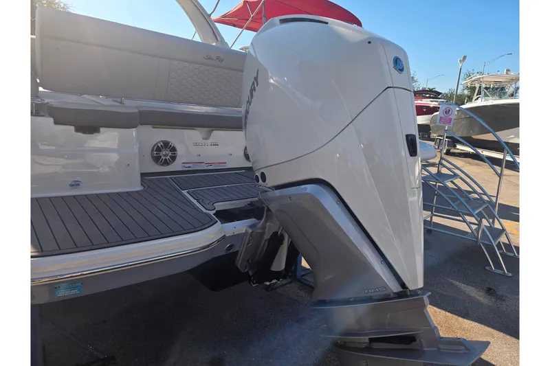 Slide: The Image of 2024 Sea Ray SDX 250 Outboard boat with powerful engine and sleek design. - 18