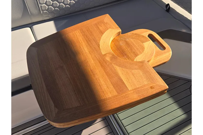 Slide: The Image of Wooden cutting board on 2024 Sea Ray SDX 250 Outboard boat seat. - 24