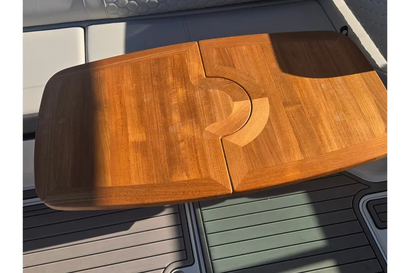Slide: The Image of Teak table on 2024 Sea Ray SDX 250 Outboard boat, showcasing elegant design. - 25