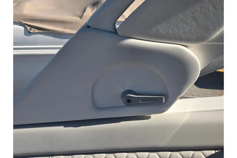 Slide: The Image of 2024 Sea Ray SDX 250 Outboard interior detail with light gray upholstery. - 27