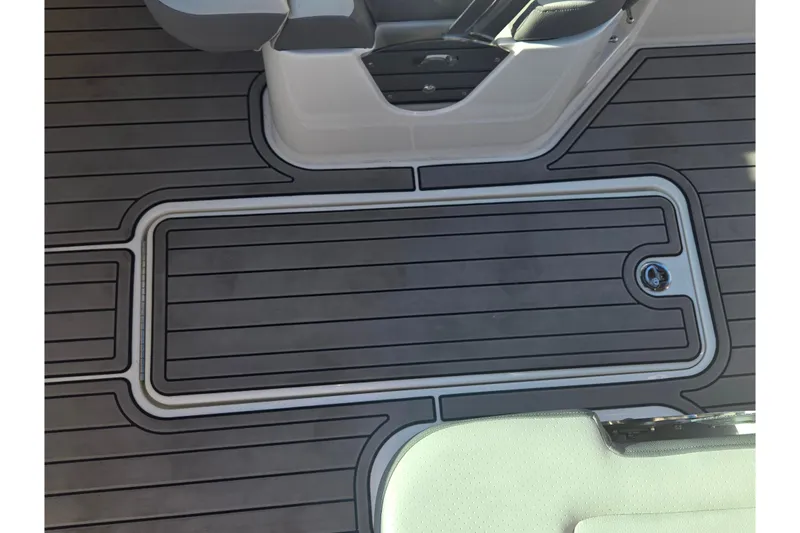 Slide: The Image of 2024 Sea Ray SDX 250 Outboard deck with sleek, modern design and durable flooring. - 33