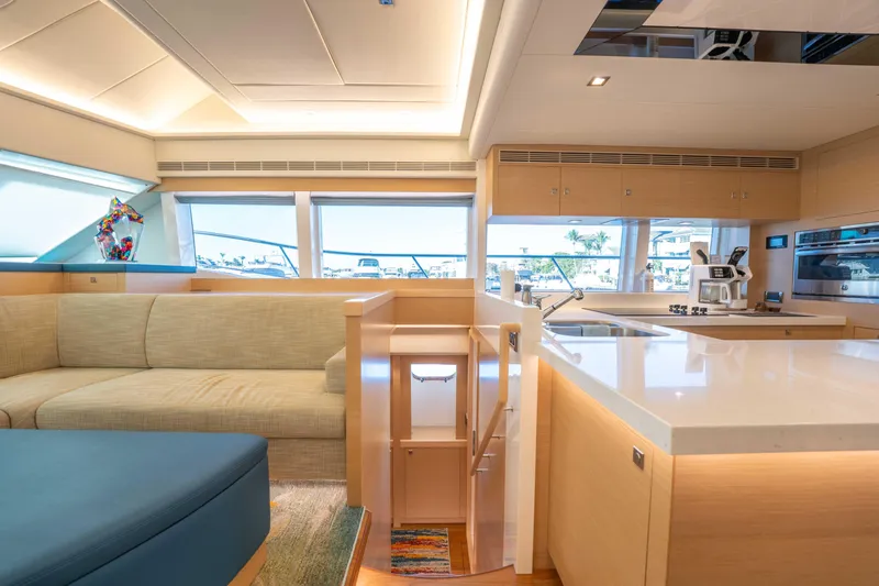 Slide: The Image of Luxurious interior of 2016 Horizon PC52 yacht with modern kitchen and seating area. - 13