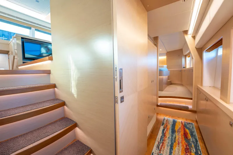 Slide: The Image of Luxurious interior of 2016 Horizon PC52 yacht with modern design and vibrant rug. - 14