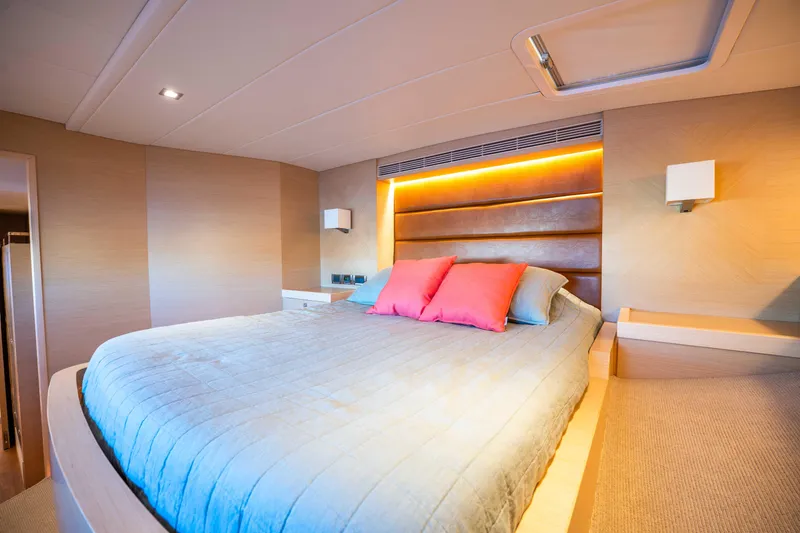 Slide: The Image of Luxurious bedroom interior on 2016 Horizon PC52 yacht with modern lighting and cozy bedding. - 18