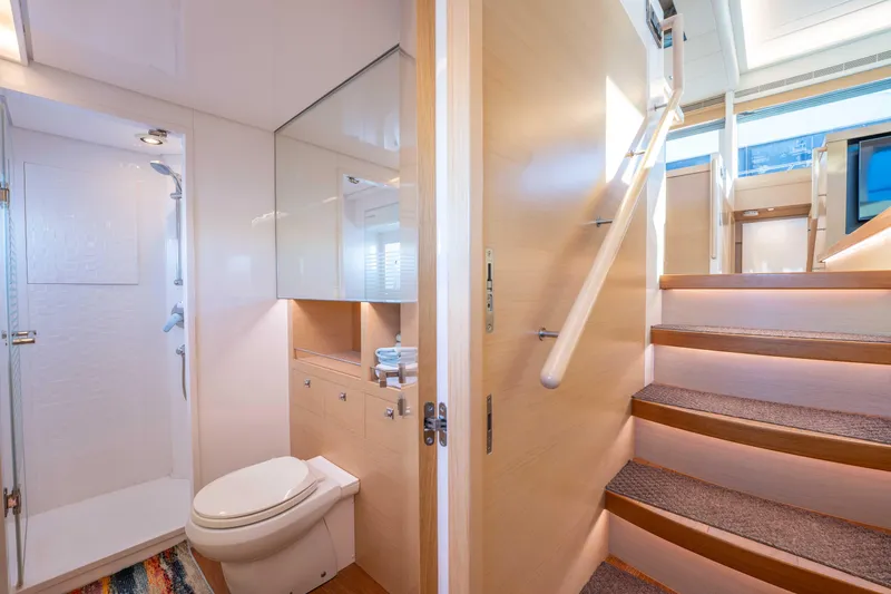 Slide: The Image of Luxurious bathroom and staircase in 2016 Horizon PC52 yacht interior. - 19