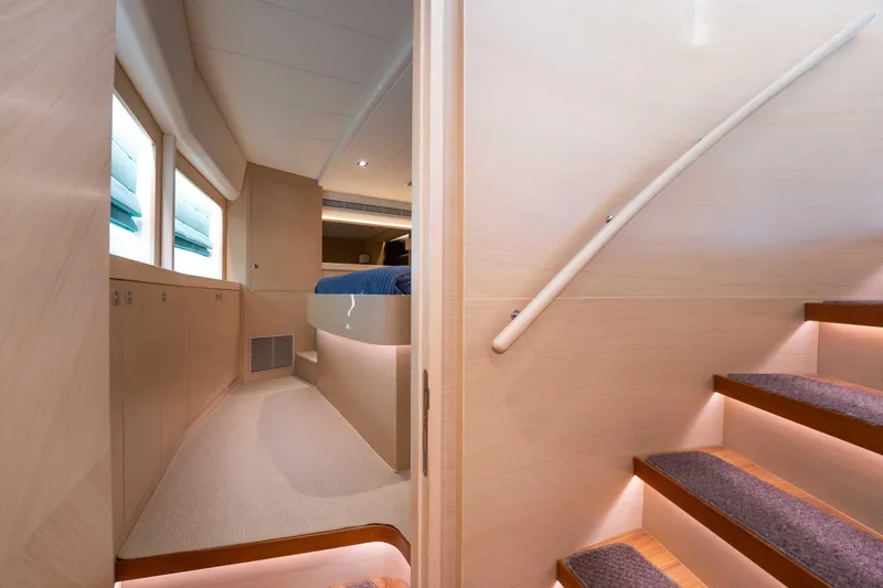 Slide: The Image of Interior of 2016 Horizon PC52 yacht with modern staircase and cozy cabin. - 23