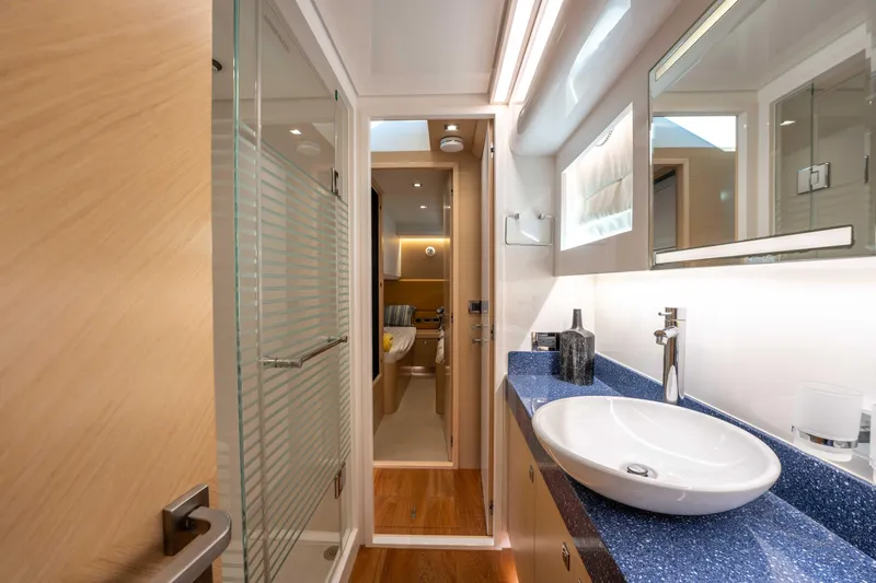 Slide: The Image of Luxurious bathroom interior on 2016 Horizon PC52 yacht, featuring modern sink and shower. - 26