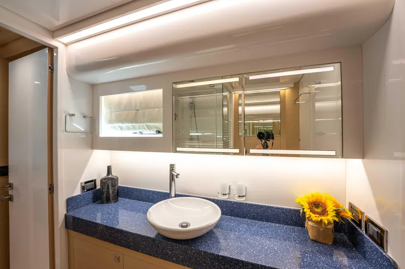 Slide: The Image of Luxurious bathroom in 2016 Horizon PC52 yacht with modern fixtures and elegant decor. - 27