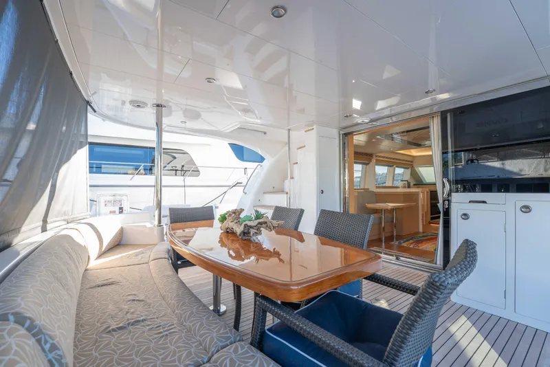Slide: The Image of Luxurious 2016 Horizon PC52 yacht interior with elegant dining area and modern furnishings. - 34