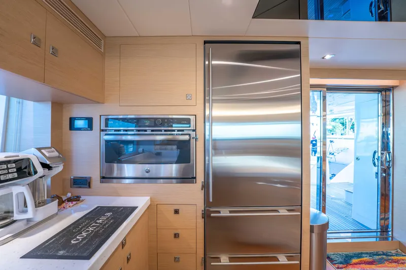 Slide: The Image of Modern kitchen on 2016 Horizon PC52 yacht with stainless steel appliances and sleek design. - 4