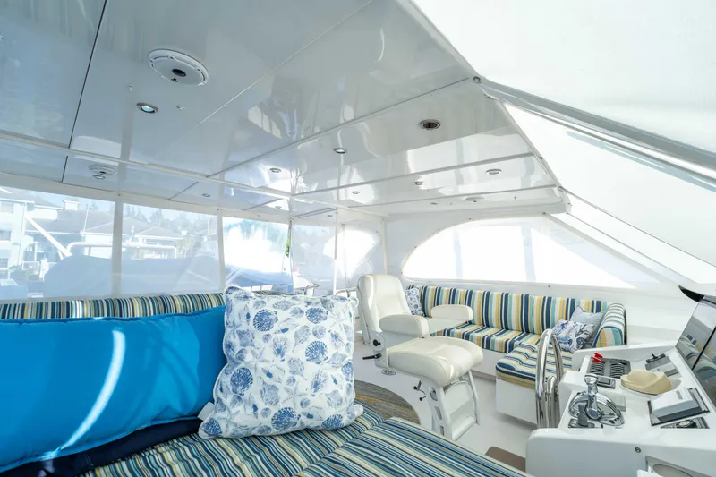 Slide: The Image of Luxurious interior of 2016 Horizon PC52 yacht with striped seating and nautical decor. - 46