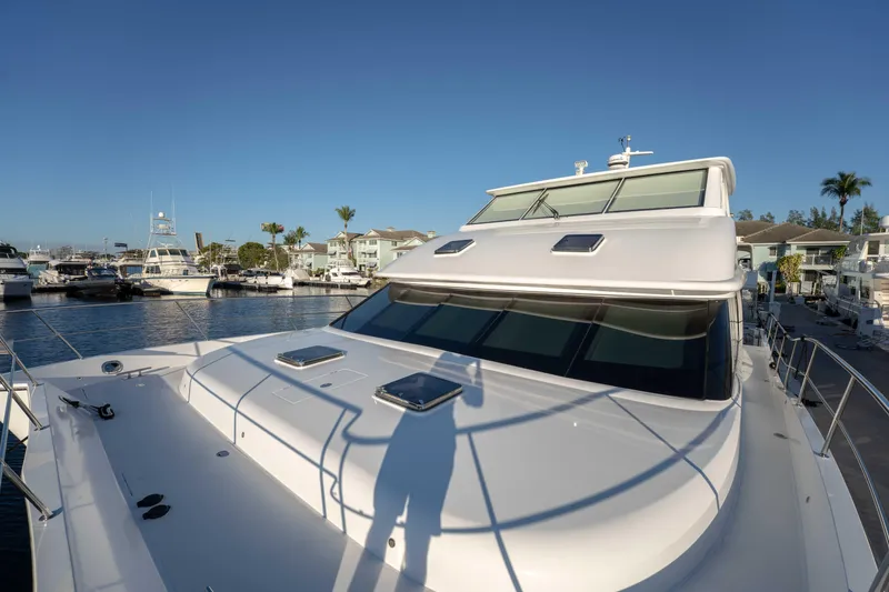 Slide: The Image of 2016 Horizon PC52 yacht docked at marina under clear blue sky. - 47
