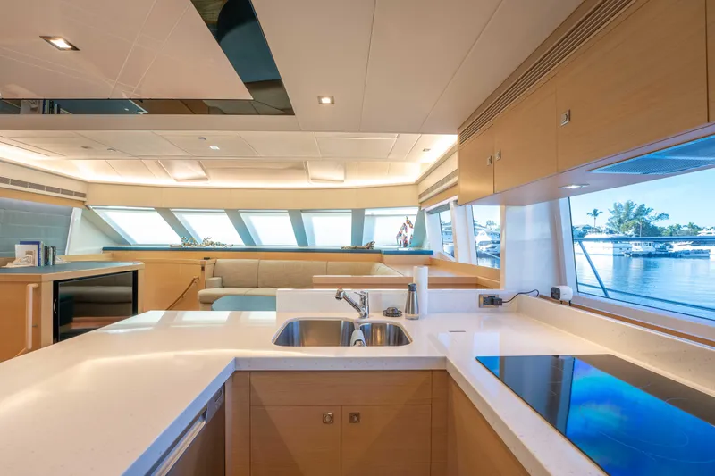 Slide: The Image of Luxurious interior of 2016 Horizon PC52 yacht with modern kitchen and scenic window views. - 5
