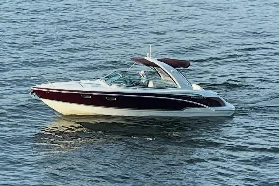 The Image of 2007 Formula 310 Sun Sport boat cruising on open water. - 0